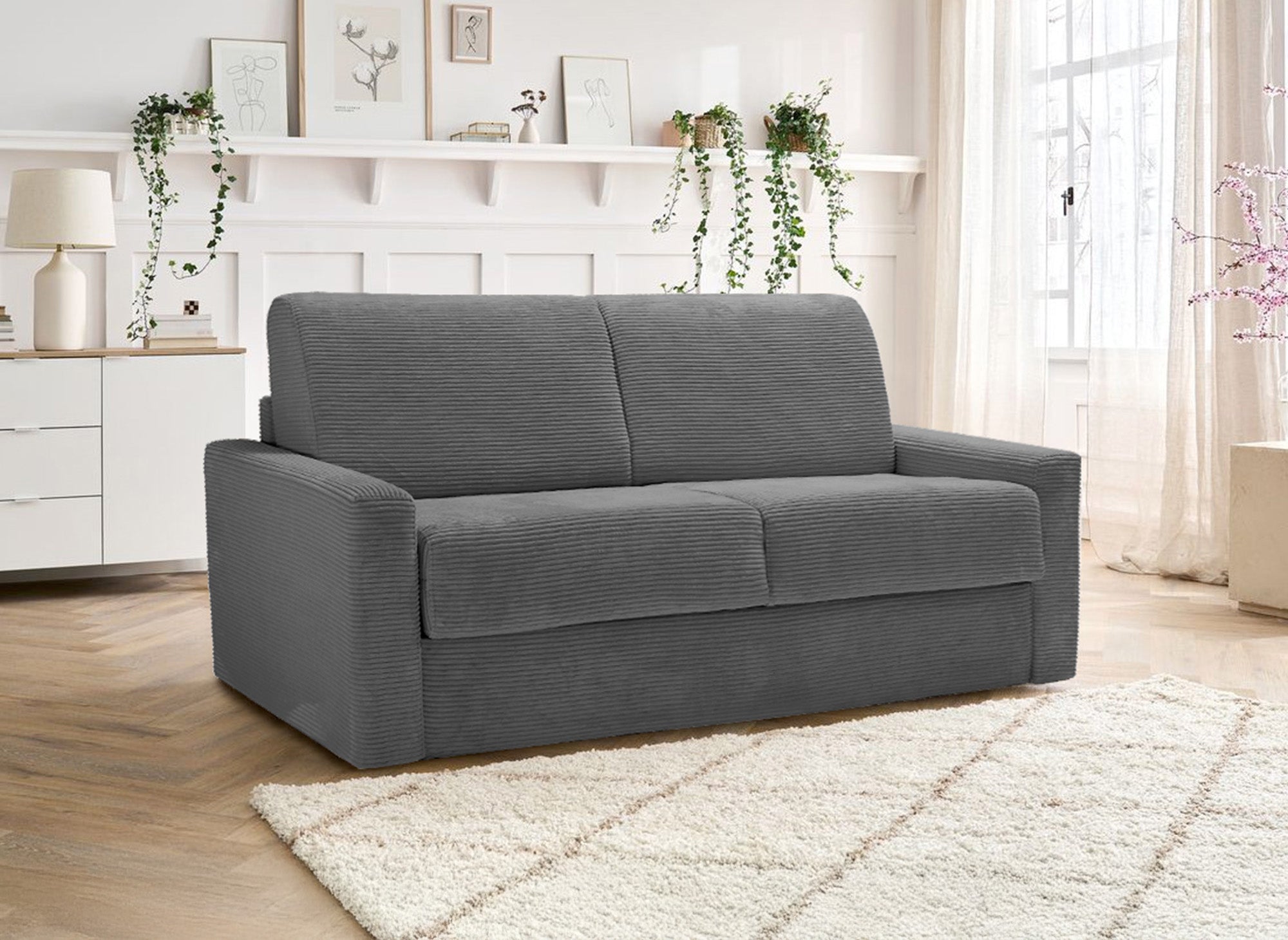 Sofá cama LOUNA LUXE de 3 plazas en pana gris oscuro con apertura rápida y colchón de 18 cm.